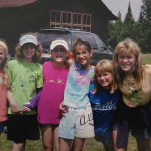 Emily (second from the left) and her Girl Scout troop at Camp Birch Trails in 2002.